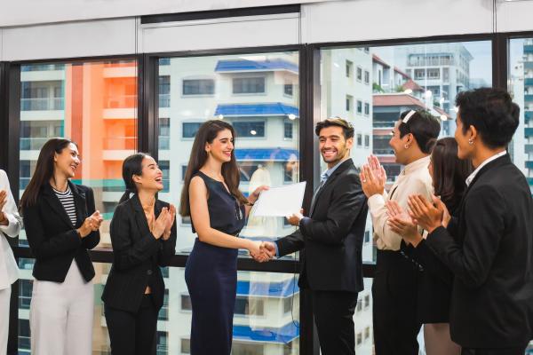 A certificate being presented to a business person