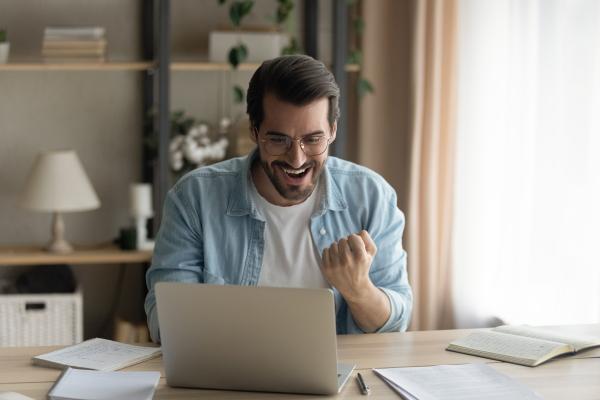 Happy man at a laptop