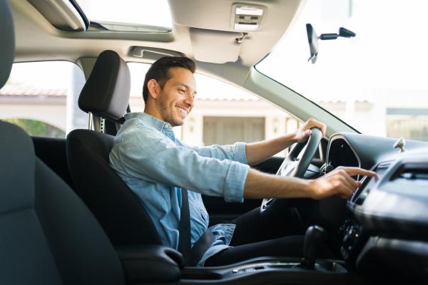 man driving car