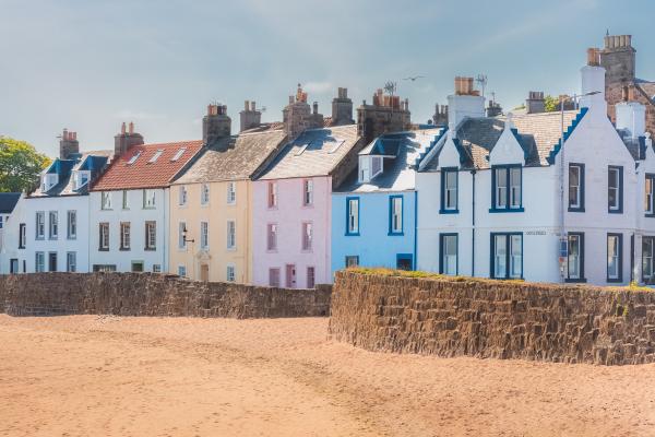 Row of colourful houses along a beach