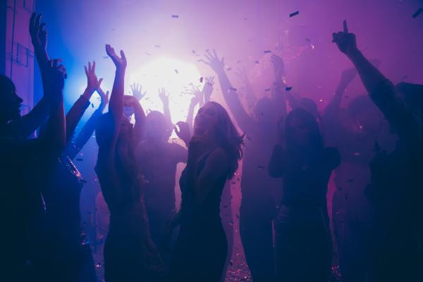 People dancing in a party or nightclub setting